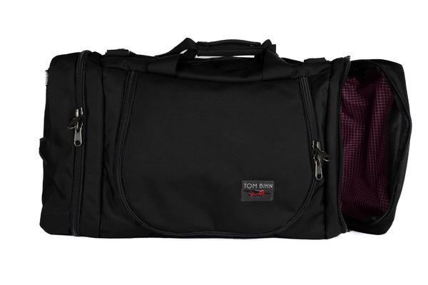 A Black Ballistic Aeronaut 45 with the end pocket open showing the Acai (purple) Halcyon.
